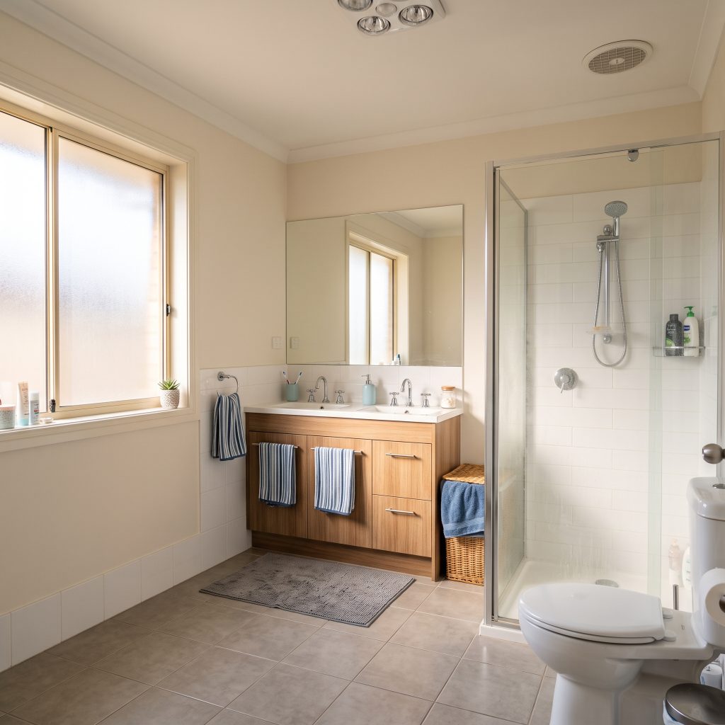 Steamy family bathroom with shower and vanity